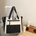 Black and white canvas tote bag with large capacity, shoulder strap and front zipper pocket. - Tote Bag / No Pendant / Black (Tote Bag)