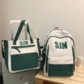 White and dark green two-piece school backpack and tote bag set with SJN print, stylish style. - 2-Piece Set in Green with Pendant