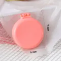 Rosa klappbare Haarbürste, süßer runder Kompakt-Massagekamm im Makaron-Stil mit Spiegel. - Einzelverpackung / Rosa