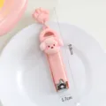 Süßer Cartoon Welpe Nagelknipser mit Pfotenanhänger, tragbares Klapp-Maniküre-Werkzeug für Alltag. - Rosa Hund