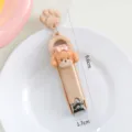 Süßer Cartoon Welpe Nagelknipser mit Pfotenanhänger tragbares klappbares Manikürewerkzeug - Milchbrauner Welpe