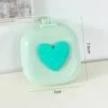 Macaron farbene klappbare Mini Haarbürste mit Spiegel und Herz Design für Reise und Alltag. - Grünes Herz