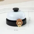 Metal service desk bell with cute cartoon bear character figure, 6.4cm diameter, 4.3cm height. - Hooded Bear