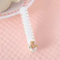 Portable folding hair comb with cute cartoon bear decoration, compact design for daily travel use. - Fishbone Style / White