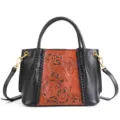 Vintage floral carved genuine leather handbag with black sides, top handle and shoulder strap. - Black