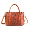 Handgefertigte Vintage Leder Handtasche mit Blumenprägung und geflochtenen Details, braun. - Braun