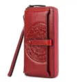 Red genuine leather long wallet for women with wrist strap, card slots and embossed lucky pattern. - Burgundy