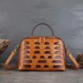 Retro vegetable-tanned cowhide dumpling handbag, large capacity woven style crossbody bag for women. - Coffee Brown