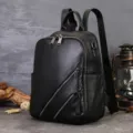 Black leather backpack for women, genuine cowhide commuting travel bag with multi-zipper pockets. - Black