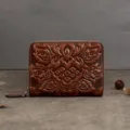 Vintage embossed leather wallet card holder with zip closure and compact accordion design. - Brown