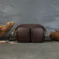 Dark brown genuine leather vintage camera bag with double front pockets and gold hardware. - Coffee