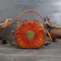 Retro genuine leather round shoulder bag with vintage sunflower embossing, elegant women handbag. - Brown