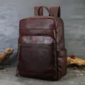 Vintage genuine leather backpack for men women, casual travel daypack with multiple pockets. - Brown