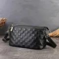 Black genuine leather crossbody shoulder bag with stylish embossed checkerboard pattern design. - Checkered