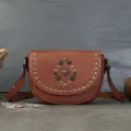 Vintage brown leather saddle bag with metal studs and retro gemstone decoration for women. - Brown