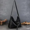 Black cowhide leather hobo shoulder bag, large capacity commuting tote with metal lock. - Black