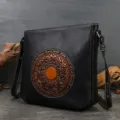 Black leather shoulder bag featuring a vintage copper embossed mandala pattern and chic design. - Gray