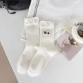Detail view of white cute puppy embroidered ruffle socks, cozy cotton mid-tube kawaii hosiery. - One Size / xc2332 White