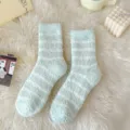 Cozy fuzzy striped coral fleece socks detail shot in soft green and white tones for winter warmth. - One Size / Green