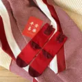 Red Chinese New Year cotton socks with plush character decor, festive winter gift socks. - Auspicious