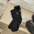 Black mid-calf socks with white heart bow jacquard knit design for women daily wear. - One Size / Black
