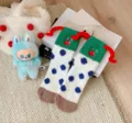 Chaussettes hiver douces en molleton de corail avec broderie clown drôle et cornes rouges. - Taille unique / Blanc avec revers vert émeraude