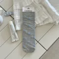 Grey slouch socks for women, featuring cute blue bow patterns and lettuce edge design. - One Size / Gray
