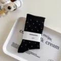 Black polka dot mid-tube socks with paper band, soft Japanese style casual wear. - Black