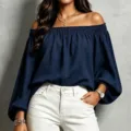 Detailed view of the navy blue off-the-shoulder long sleeve top, elastic neckline. - S / Navy Blue