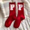 Red mid-calf socks for women featuring white letter P knit design, cozy cotton winter wear. - Letter P