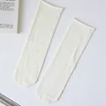 Casual minimalist solid white crew socks, soft roll-top design, comfortable daily wear. - Cream