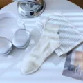 Men's casual cotton short socks in off-white, featuring ribbed cuff and subtle embroidery detail. - SK Cream White