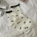 White cotton mid-calf socks with black lace trim and cute bow prints for women variant. - One Size / Cream Butterfly Lace