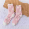 Pink fluffy winter socks with white star pattern, cozy coral fleece material for homewear. - One Size / Light Pink