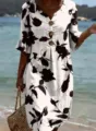 Resort style V-neck floral print dress detail, showing half sleeves and wooden buttons. - S / Dresses / White with Black Flowers