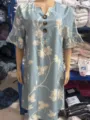 Detail view of a casual V-neck floral embroidered midi dress featuring short ruffle sleeves. - In Stock Ready To Ship