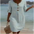 Detail view of a light blue v-neck floral print loose short sleeve vacation dress. - Blue Tiny Floral