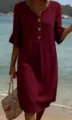 Detail of the V-neck burgundy resort dress featuring stylish wooden buttons and mid sleeves. - Dark Red