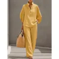 Yellow linen two-piece set featuring a loose long-sleeve top and matching wide-leg trousers. - Yellow