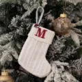 White knitted Christmas stocking with embroidered letter M and Santa hat for holiday gift candy bags. - Embroidered Knitted Small Sock White M