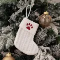White knitted Christmas stocking with red paw print embroidery, holiday gift bag variant. - Embroidered Knitted Small Sock White Paw Print