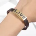 Close-up detail of vintage style men's brown PU leather bracelet with antique bronze metal plate. - Heart LOVE Letter Style / Bronze Brown
