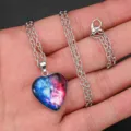 Heart shaped crystal glass pendant necklace with wolf design on silver chain detail - Starry Sky Twin Wolves Style (AA369)
