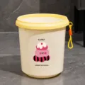 Cute plastic garbage bin with cute cake bear design, lemon yellow lid and hanging loop. - Lemon Yellow