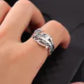 Close-up detail shot of vintage silver adjustable hummingbird ring with intricate floral relief. - Open Adjustable / Silver