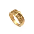 Close-up detail of the gold-colored mushroom and star engraved ring surface texture. - Size 7 / Gold