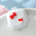 Peine de cojín de conejo lindo portátil con lazo rojo, cepillo de pelo blanco compacto. - Conejo con Lazo / Blanco