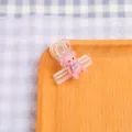 Clip di plastica trasparente con simpatico orsetto rosa, ideale per scuola e ufficio. - Orsetto Rosa