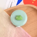 Lindo mini metro flexible verde de rana portátil retráctil regla suave para medir costura - Cinta métrica de rana
