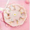 Cute cartoon gumball keychains set for women, sweet pink style metal ring bag pendant. - Random Style